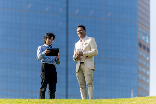 Business professionals discussing strategy outdoors in Melbourne