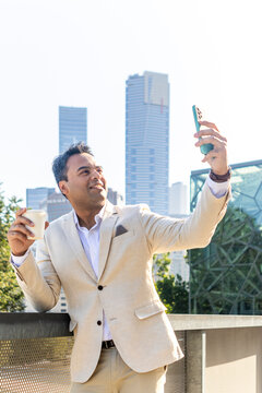Melbourne professional taking selfie with skyline backdrop
