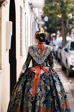 Traditional fallera dress in Valencia street scene