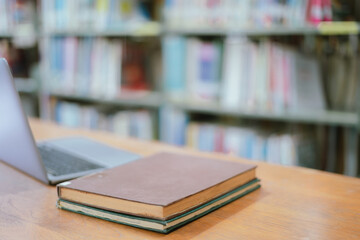 Books in the library and a laptop represent the concept of basic education.
