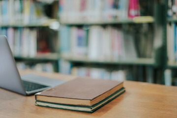 Books in the library and a laptop represent the concept of basic education.
