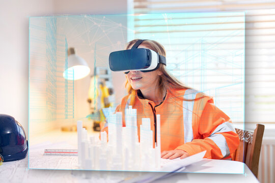 Young female building construction engineer explores virtual reality for 3D architectural design at modern workspace