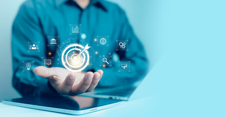 Businessman showing virtual target icon for business purpose, strategic planning for business...