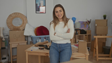 Woman smiling in new home with unpacked boxes reflects comfort and excitement creating a welcoming...