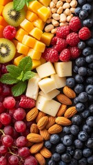 Colorful fruit and nut platter with cheese and mint leaves