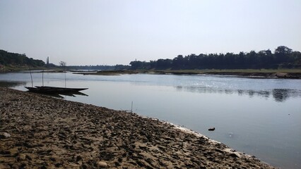 a body of water with a boat on the shore