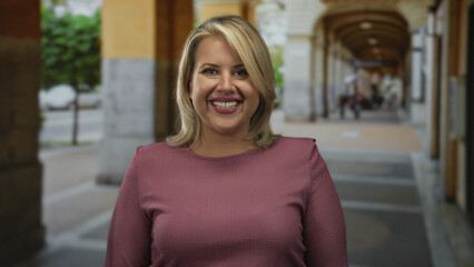 Blonde woman furrows brow at camera on a cobblestone street in historic old town; inner...