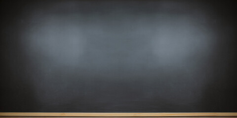 Empty black chalkboard in school setting, ideal as education background