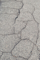 The cracked pavement is a reflection of the city's neglect