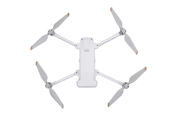 A white foldable drone with four propellers against a white back
