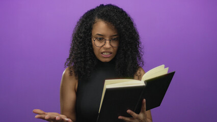 Young woman reading book with puzzled expression over isolated purple background