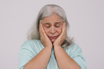 Indian sad and depressed senior old woman 
isolated on white background