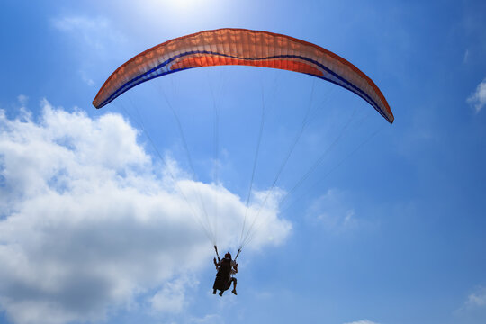 Paraglider flies paraglider in the sky. Paragliding.