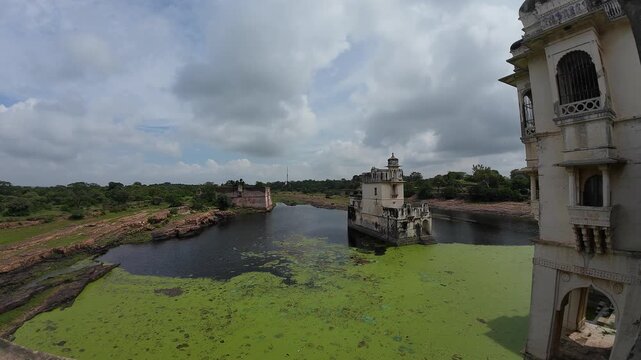 The Serene Rani Padmini Mahal: A Queen's Palace Reflected in a Pond, Chittorgarh Fort, Rajasthan, India 