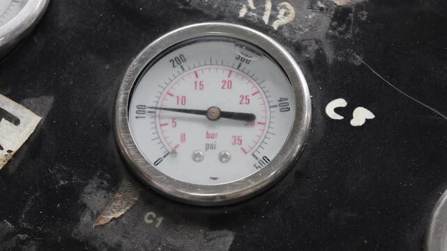 Pressure gauge or manometer shows a decrease or drop pressure. mechanical installation air pressure manometer.
