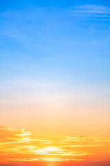 Beautiful , luxury soft gradient orange gold clouds and sunlight on the blue sky perfect for the background, take in evening,Twilight, Large size, high definition landscape photo,Vertical