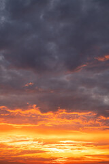 Beautiful , luxury soft gradient orange gold clouds and sunlight on the blue sky perfect for the background, take in evening,Twilight, Large size, high definition landscape photo,Vertical
