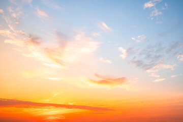 Fototapeta premium Beautiful , luxury soft gradient orange gold clouds and sunlight on the blue sky perfect for the background, take in evening,Twilight, Large size, high definition landscape photo