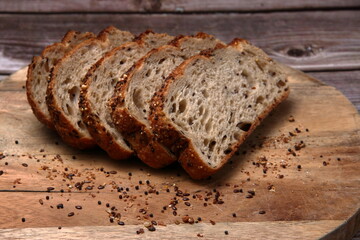 Multi-Grain Bakers Bread on Wooden Board.