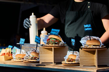 Close-up of delicious burgers during a hamburger food truck festival.