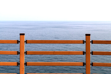 view of the wooden safety fence against the sea