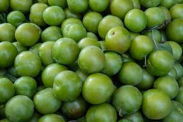 Fresh Green Plums Close-Up at a Farmers Market