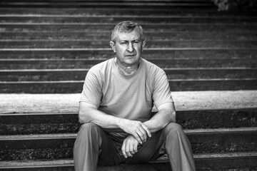 Pensive European senior man, emotional portrait of reflection and life challenges. Emotive portrait...