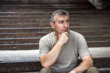 Pensive European senior man, emotional portrait of reflection and life challenges. Emotive portrait...
