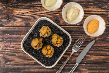 Gourmet quinoa balls with crispy texture and artistic garnish