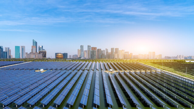 Solar panels and city skyline with modern architecture