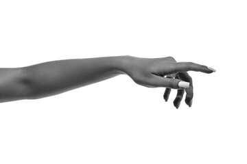 Female hand with white manicure in elegant reaching gesture isolated. Concept of cosmetic and nail...