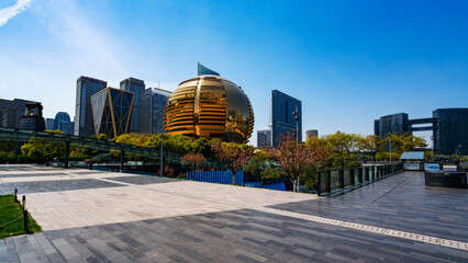Modern Architecture with Golden Sphere in Urban Square