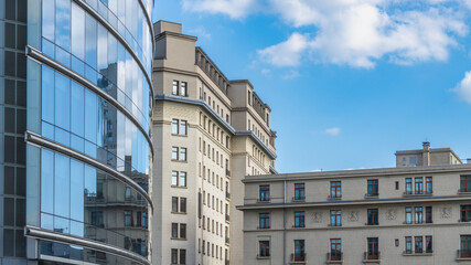 Skyscrapers with glass facades reflect other, old and new buildings, Panoramas from Rond Point place, Old buildings are transformed by building new ones over them. Old is reflected in new, interesting