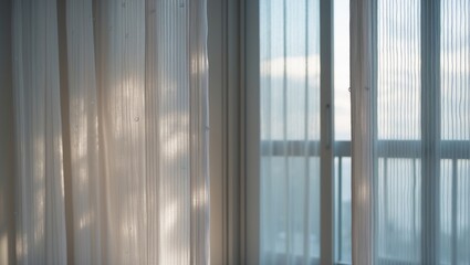 Light curtains on a window with sunlight shining through.