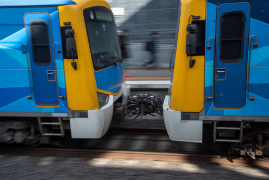 Metro train coupling as the train moves along the platform