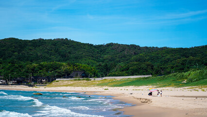Summer Beach with Colorful Parasol at Kotogahama in Noto, Japan