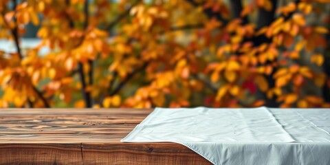 Empty rustic wooden table with crisp white tablecloth, autumn leaves blurred background, photography, texture