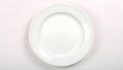 Minimalist top-down flatlay of an empty white ceramic plate, a powerful concept for World Food Day awareness.