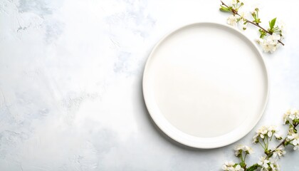 An empty white ceramic plate with cherry blossoms on a light table, a thoughtful concept for World Food Day.