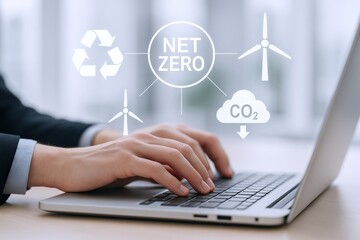 Net Zero Concept: Businessman Working on Laptop with Environmentally Friendly Icons for Sustainable Future