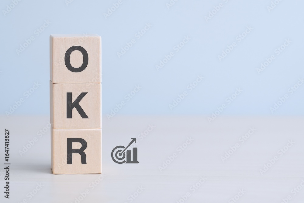 Poster objectives and key results concept: stacked wooden blocks with okr text and target icon