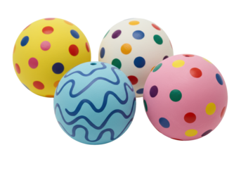 Four distinct, smooth ceramic spheres with colorful hand-painted patterns, clustered on transparent, soft studio lighting. Concept of artistic creativity and joy