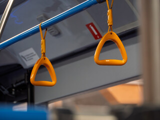  Brightly Colored Bus Handholds for Commuters in Urban Transit