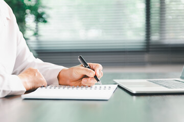 Businesswoman manages finances by using banking and accounting system to calculate costs, taxes,...