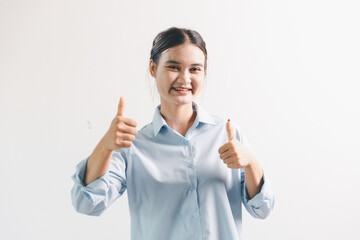 Asian woman rejoicing, looking happy, champion, fist pump gesture, standing over white background....
