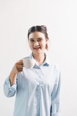 Asian woman rejoicing, looking happy, champion, fist pump gesture, standing over white background....