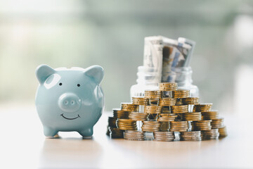 Money box filled with coins, saving cash, banking wisely, making sound investments can build financial wealth, personal finance and overall economy through proper business and currency management.