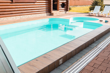 Swimming pool at a house closeup background.