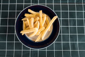 French fries on a plate with copy space.