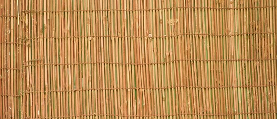 Minimalist natural reed bamboo mat close-up, perfect for table settings, blinds, and eco-friendly decoration.